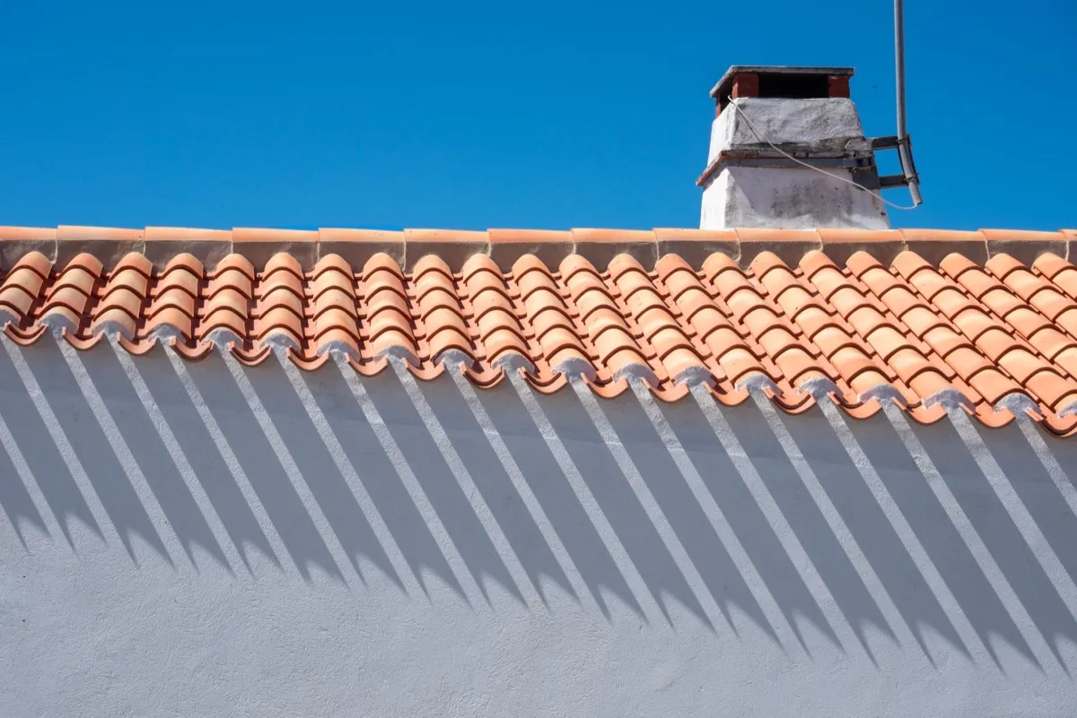 Roof ridge line and chimney on a home in Levelland, TX